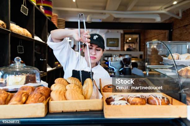 Service At The Counter For Owner Of A Small Bakery Shop Stock Photo - Download Image Now