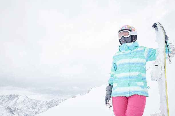 istock Young woman with snowboard 926274802