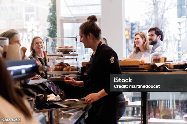 Customer Service In A Small Local Bakery Shop Stock Photo - Download Image Now - Bakery, Community, Waiting In Line