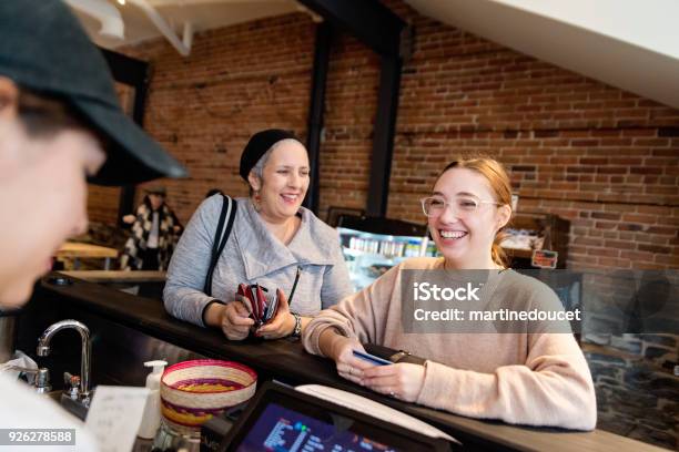 Customer Service In A Small Local Bakery Shop Stock Photo - Download Image Now - Community, Bakery, Coffee Shop