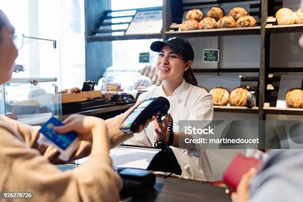 Customer Service In A Small Local Bakery Shop Stock Photo - Download Image Now - Small Business, Owner, Paying