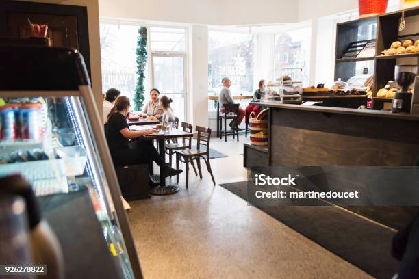 Customer Enjoying Time In A Small Local Bakery Shop Stock Photo - Download Image Now