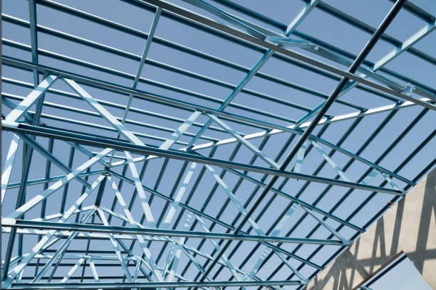 istock Structure of steel roof frame for building construction isolated on blue sky background. 926278924
