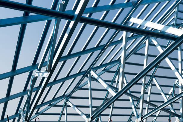 istock Structure of steel roof frame for building construction isolated on blue sky background. 926278936