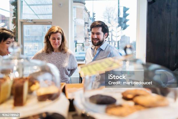 Customer Choosing Something To Eat In A Small Local Bakery Shop Stock Photo - Download Image Now