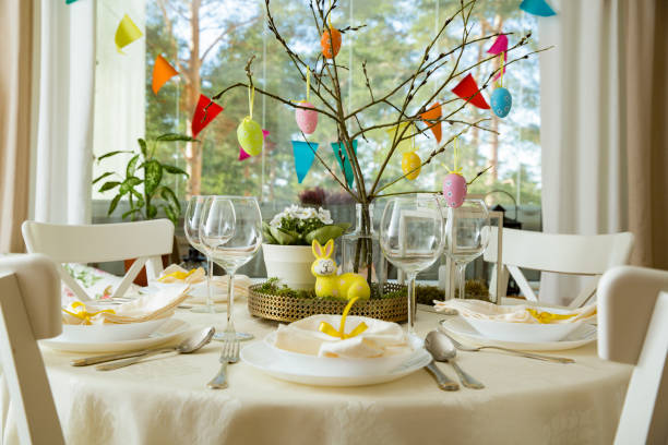 istock Beautiful served round table with decorations in dining room for Easter celebration 926279802