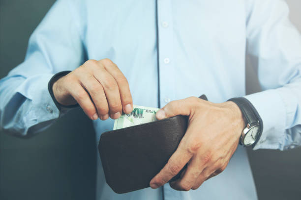 istock man hand wallet with money 926282244