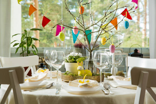 istock Beautiful served round table with decorations in dining room for Easter celebration 926282690