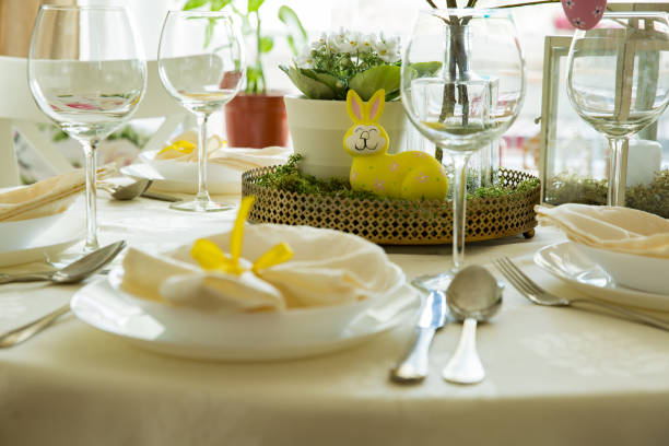 istock Beautiful served round table with decorations in dining room for Easter celebration 926282850