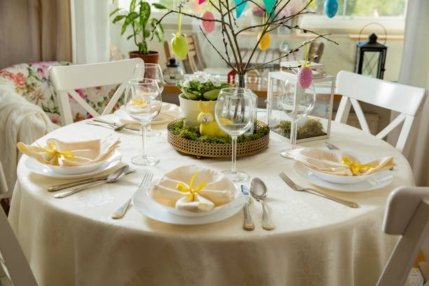 istock Beautiful served round table with decorations in dining room for Easter celebration 926282870