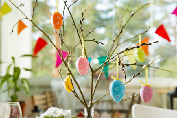 istock Beautiful served round table with decorations in dining room for Easter celebration 926286886