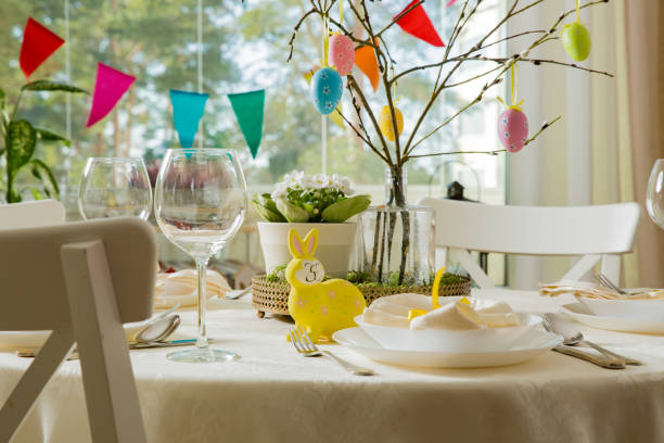 istock Beautiful served round table with decorations in dining room for Easter celebration 926287916