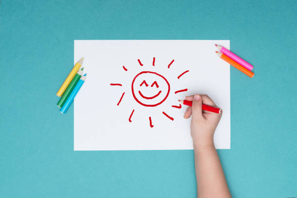 istock the boy draws on a white sheet of paper 926288066