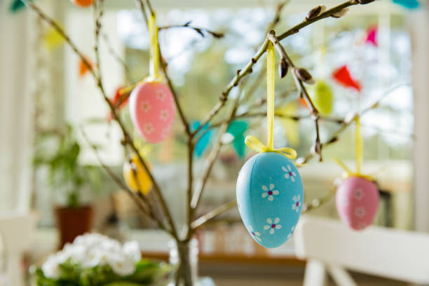 istock Beautiful served round table with decorations in dining room for Easter celebration 926288756