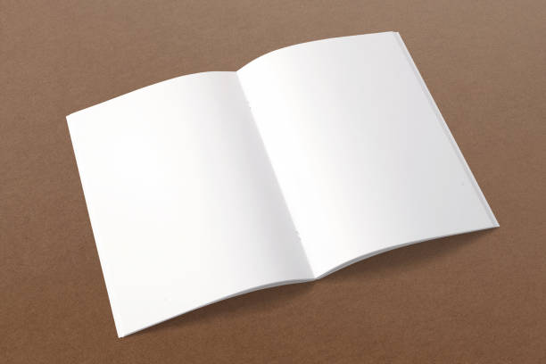istock Opened magazine on cardboard background. . blank pages. 926292218