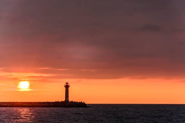 istock seascape of a Lighthouse at sunrise 926292292