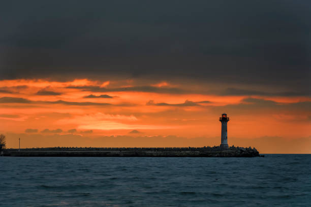 istock seascape of a Lighthouse at sunrise 926292558