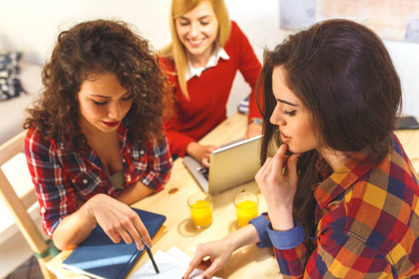 istock Group of female students study at home, learning for university exam. 926292642