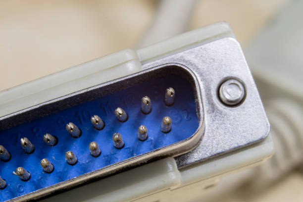 Electrical connectors at high magnification. Computer and electrical clamps and plugs shown in macro technology. Light background.