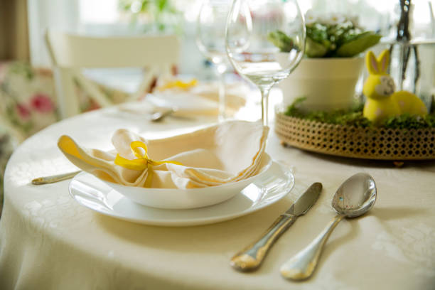 istock Beautiful served round table with decorations in dining room for Easter celebration 926293466