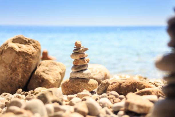 istock stone tower made of pebbles on the beach 926294598
