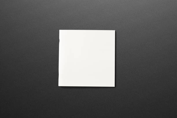 istock Square Magazine with blank soft cover on dark textured background. 3d illustration. 926308934