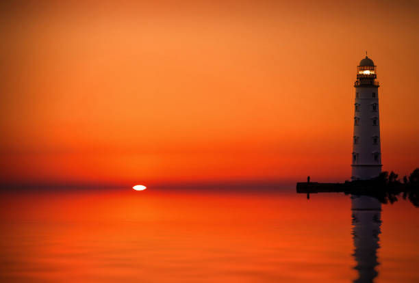 istock Lighthouse searchlight beam near ocean at sunset 926309006