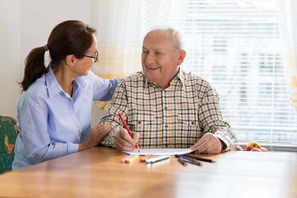 dementia and occupational therapy - home caregiver and senior adult man - occupational therapy imagens e fotografias de stock