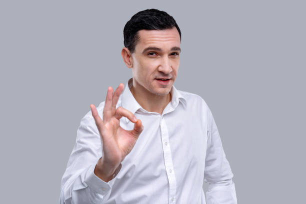 istock Pleased man showing ok with his fingers 926316370