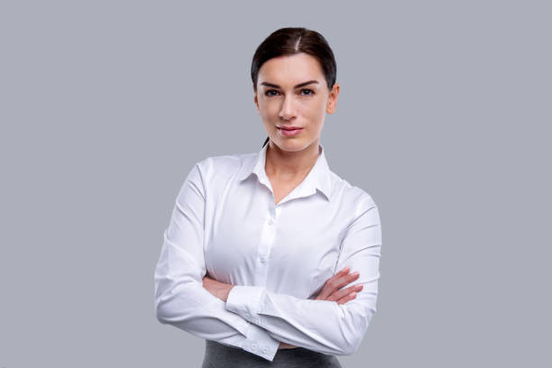 istock Happy woman standing with her arms crossed 926316496