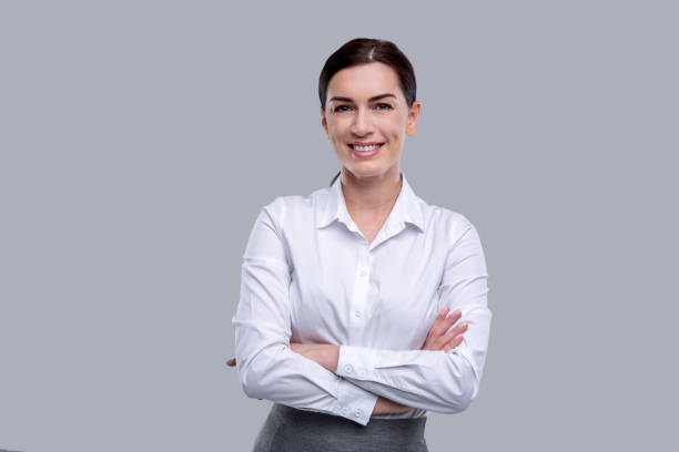 istock Smiling woman standing with her arms crossed 926316662