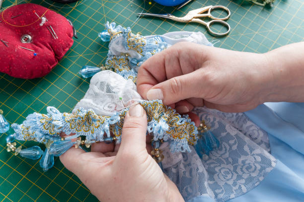 istock woman sew a needle 926321484