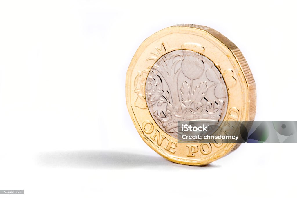 One Pound Coin A close-up shot of the new British one pound coin over a white background. One Pound Coin Stock Photo