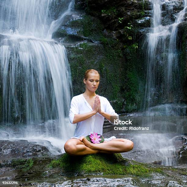 Young Woman Doing Yoga Near Waterfalls Stock Photo - Download Image Now - Adult, Adults Only, Aquatic Organism