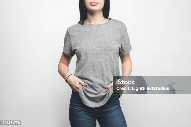 Cropped Shot Of Young Woman In Blank Grey Tshirt On White Stock Photo - Download Image Now