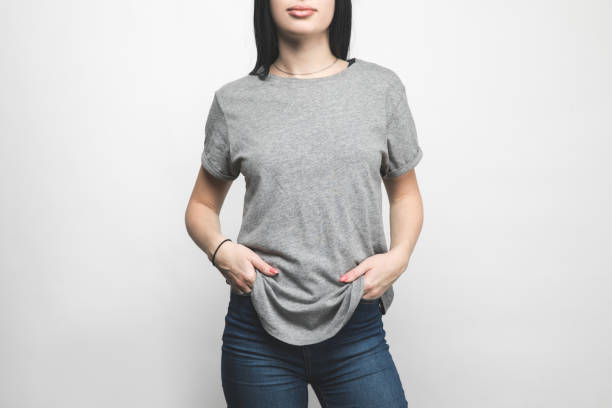 cropped shot of young woman in blank grey t-shirt on white - gray shirt imagens e fotografias de stock