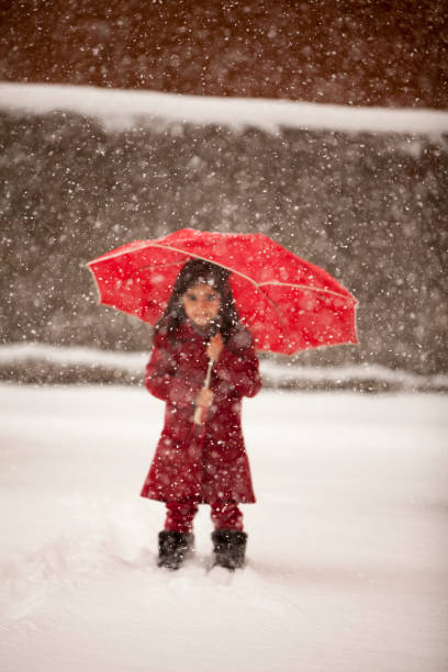 istock Child walking in snow 926343860