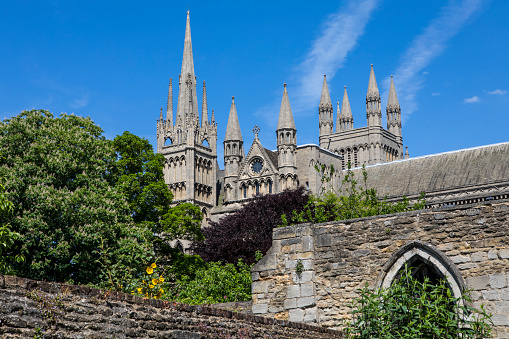 A view of the exterior of Peterborough Cathedral in the historic city of Peterborough in Cambridgeshire, UK.