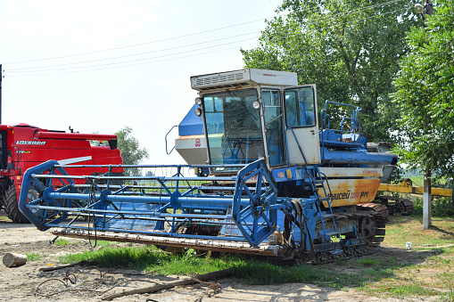 Poltavskaya village, Russia - September 06, 2017: Combine harvesters Agricultural machinery. The photo was taken at a parking lot of agricultural machinery near the village of Poltavskaya.