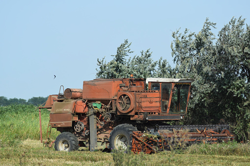 Poltavskaya village, Russia - September 06, 2017: Old rusty combine harvester. Combine harvesters Agricultural machinery