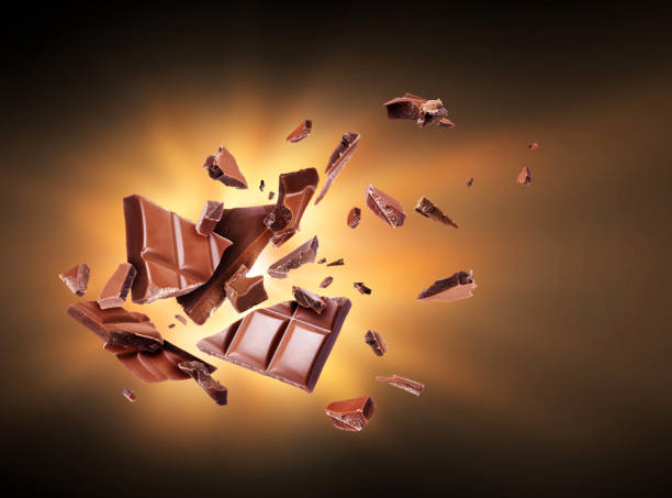 istock Chocolate is torn to pieces in the dark 926351840