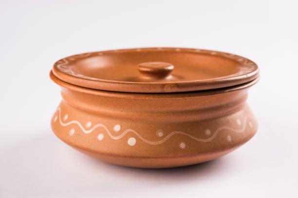 Empty terracotta serving bowl or brown clay serving bowl of oval or round or rectangle shape, isolated on white