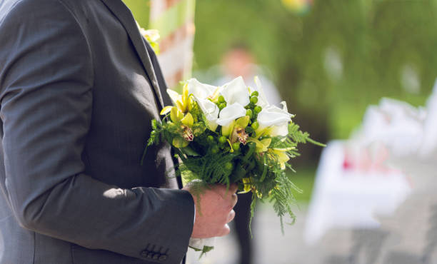 istock Groom hold wedding bouquet 926357446