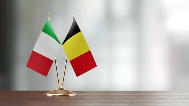 istock Italian And Belgian Flag Pair On A Desk Over Defocused Background 926357584