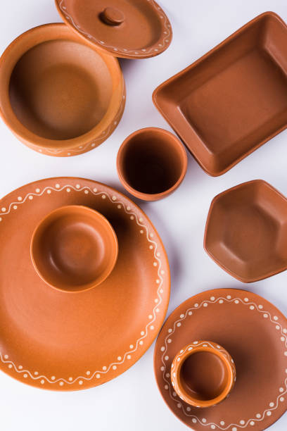 istock Empty terracotta or brown clay dish, serving bowl, plates, drinking glasses. isolated on white 926358700