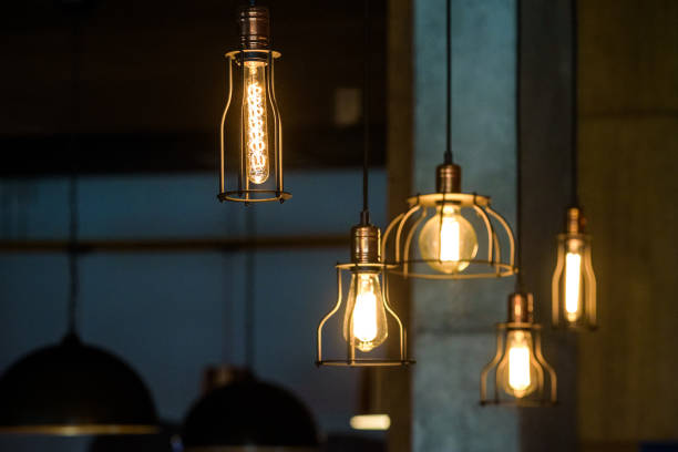 istock Industrial pendant lamps against rough wall. Loft interior. Edison bulbs 926359150