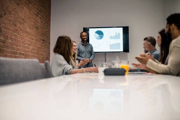 istock Young man has a presentation with the graph on an LCD screen 926362538