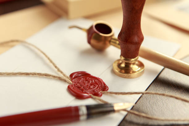 istock Notary's public pen and stamp on testament and last will. Notary public tools 926362854
