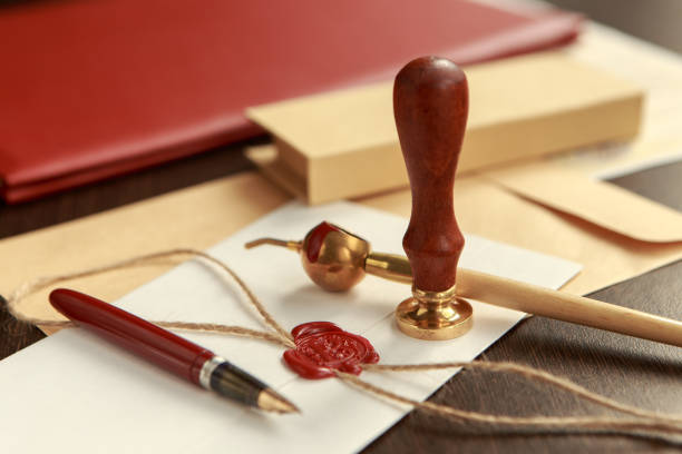 istock Notary's public pen and stamp on testament and last will. Notary public tools 926362890