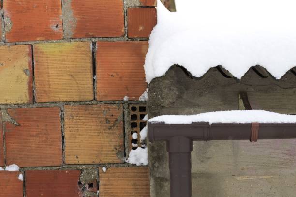 Brick wall near a snowy roof (Pesaro, Italy)